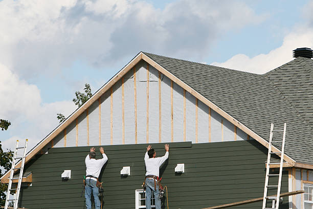 Professional Siding technician working in New Concord, OH